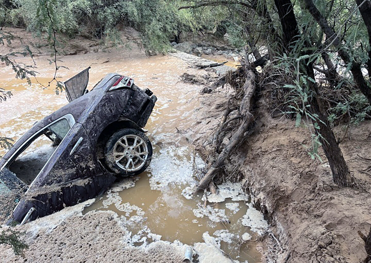 Family fought in failed bid to rescue woman swept away in wash